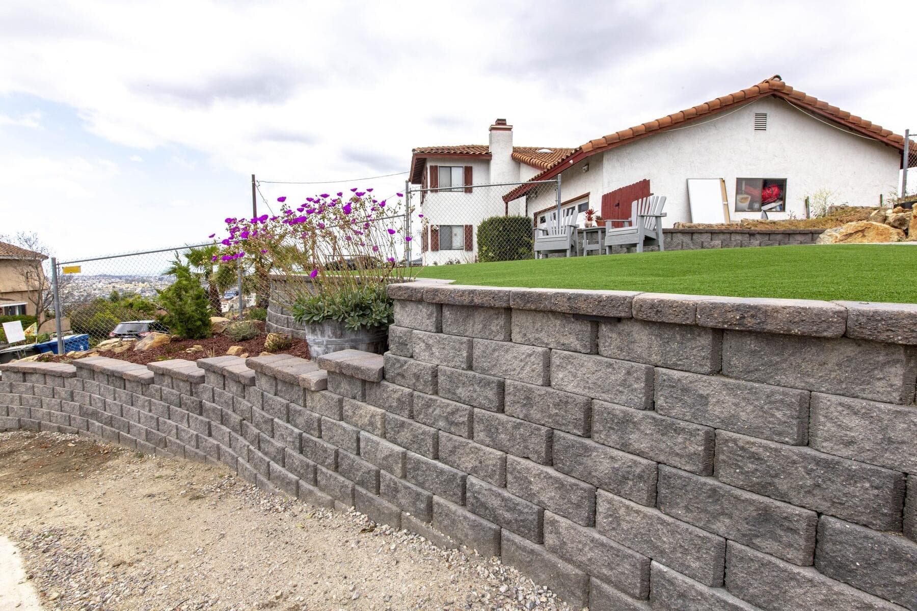 Long RidgeStone retaining wall with turf above at Dictionary Hill