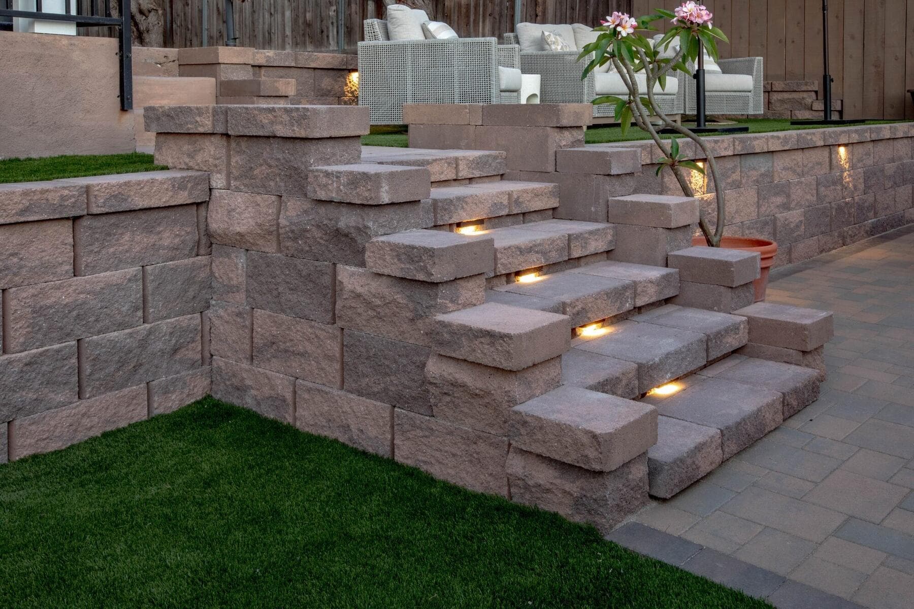 Lit block stairs seen from the turf lawn