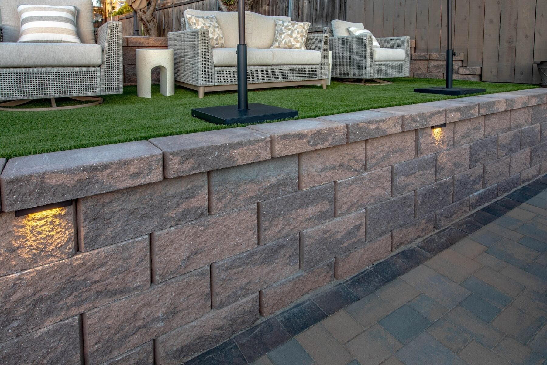 Outdoor seating on the upper turf terrace along the retaining wall