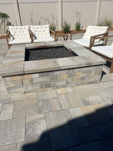 Block fire pit set in the paver patio
