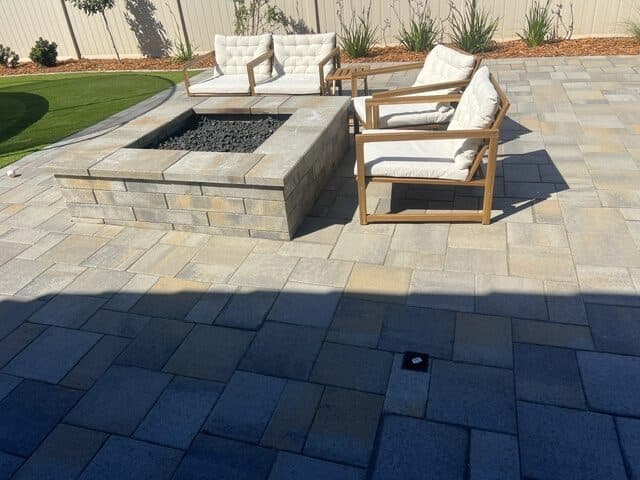 Block fire pit and lounge chairs on Catalina Grana pavers in Poway
