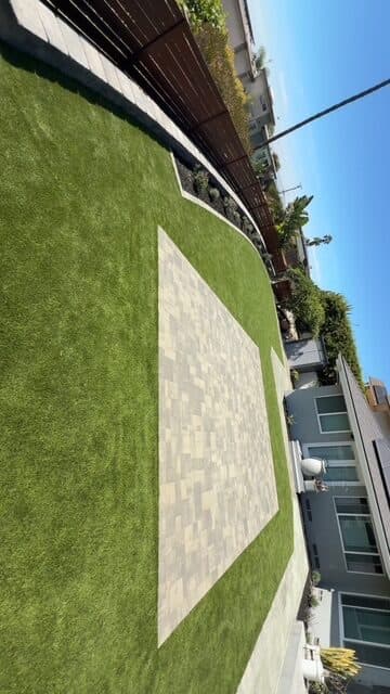 Paver patio in turf looking back toward the house